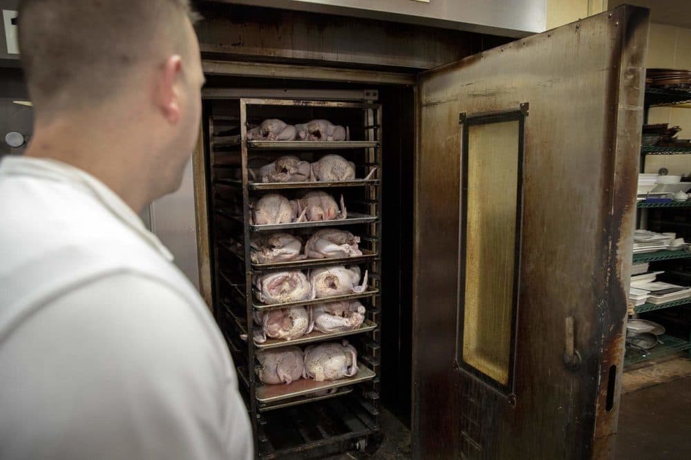 Fourteen turkeys are ready for roasting in one of the Tuscan Market's giant ovens. (Robin Lubbock/WBUR)