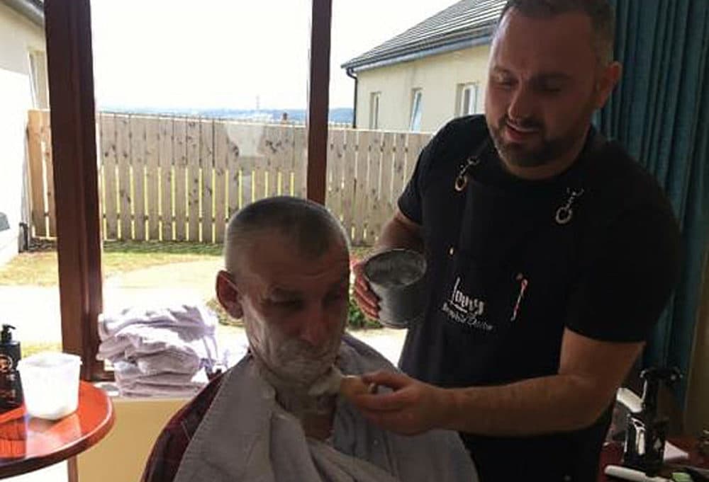 Lenny White gives a client a shave. (Courtesy via Facebook)