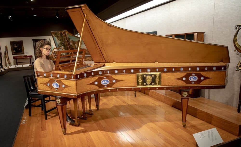 Musician Martina Wlodarczyk plays a harpsichord at the MFA Boston. The instrument was made in France, probably in 1736. (Robin Lubbock/WBUR)