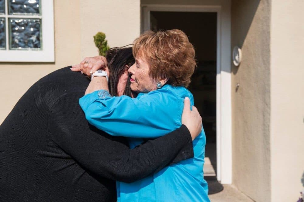 Jenn Carson reunites with her former teacher, Sylvia Case Peterson, after 35 years. (Andrew Cullen for WBUR)