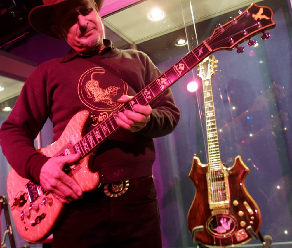 Guitar maker Doug Irwin strums &quot;Wolf&quot; an electric guitar he custom made for the late Jerry Garcia, at Studio 54 Tuesday, May 7, 2002 in New York. (AP Photo/Tina Fineberg)