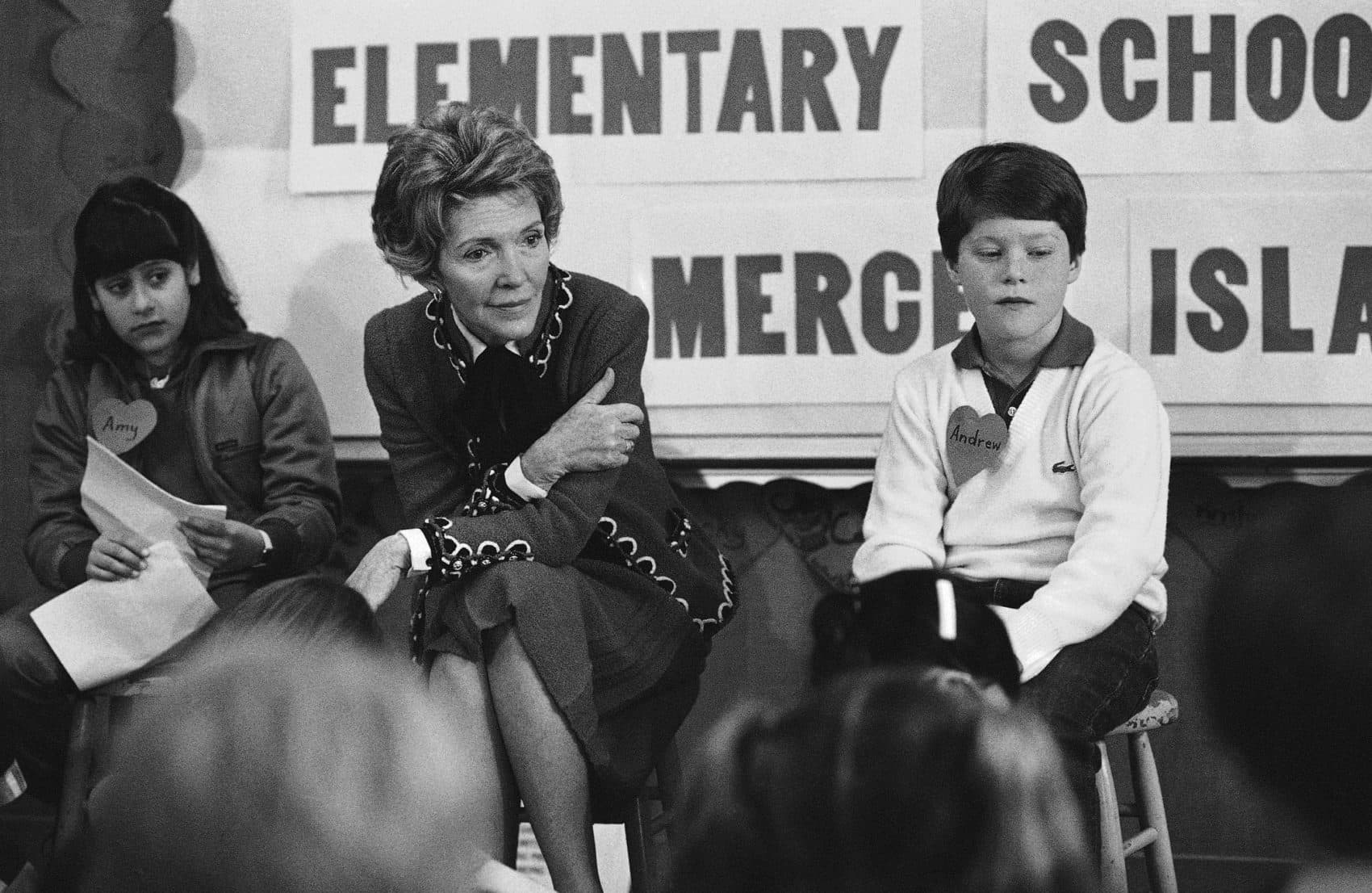 First lady Nancy Reagan sits with a fourth and fifth grade class as part of a 1984 drug education class. (AP Photo/Barry Sweet, File)