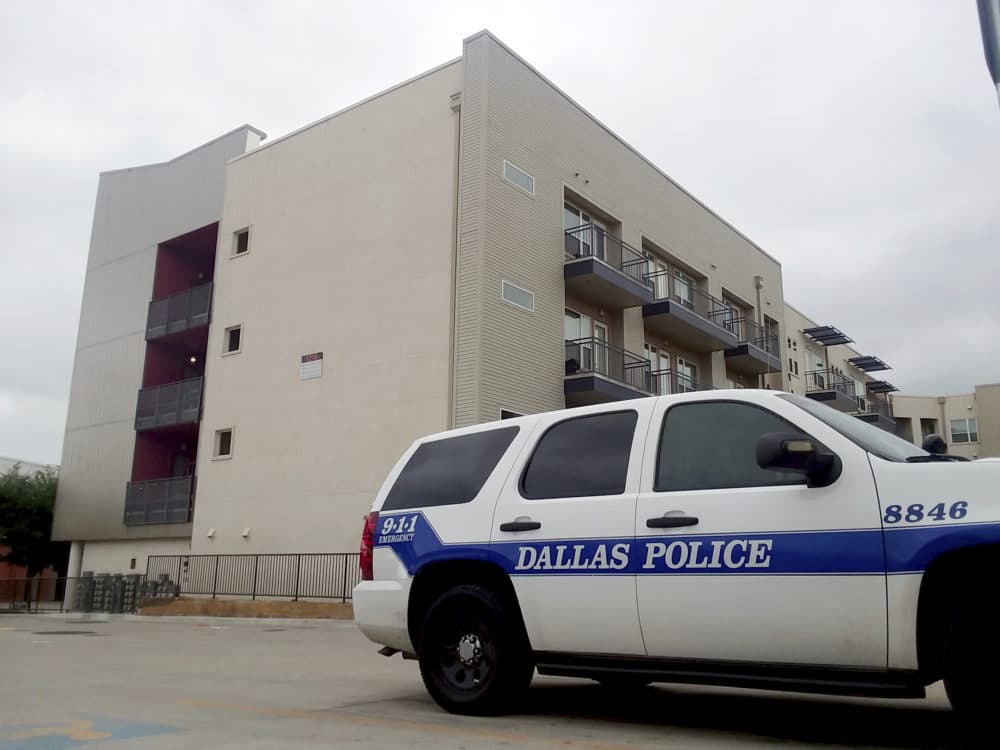 A Dallas Police vehicle is parked near the South Side Flats apartments on Monday, Sept. 10 2018 photo in Dallas. Authorities say a Dallas police officer said she shot a neighbor whose home she mistakenly entered last week after he ignored her &quot;verbal commands.&quot; David Armstrong of the Texas Rangers wrote in an arrest affidavit released Monday that Officer Amber Guyger said she didn't realize she was in the wrong apartment until after she shot 26-year-old Botham Jean and went into the hallway to check the address. Guyger was booked Sunday on a manslaughter charge in Thursday night's killing of Jean and was released on bond. (Ryan Tarinelli/AP)