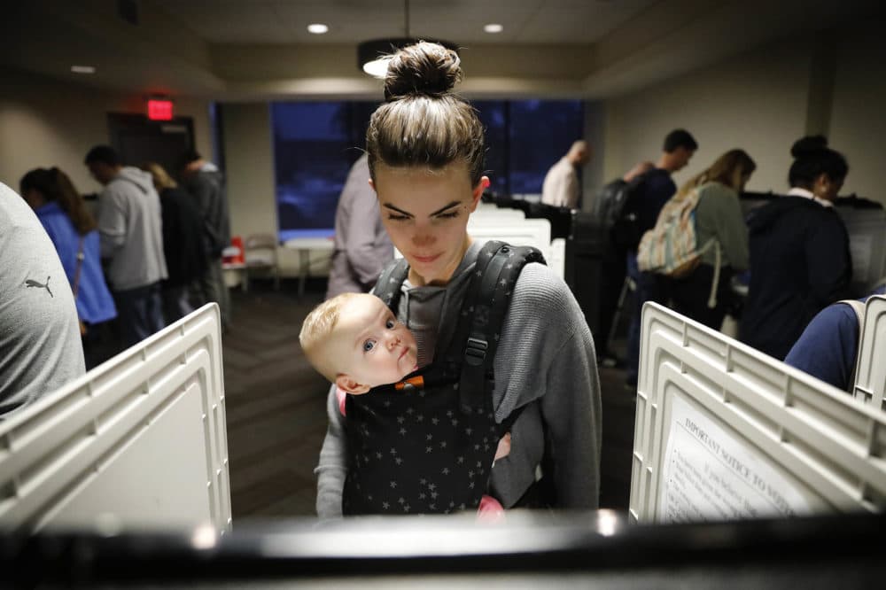 Kristen Leach votes with her six-month-old daughter, Nora, on election day in Atlanta, Tuesday, Nov. 6, 2018. (David Goldman/AP)