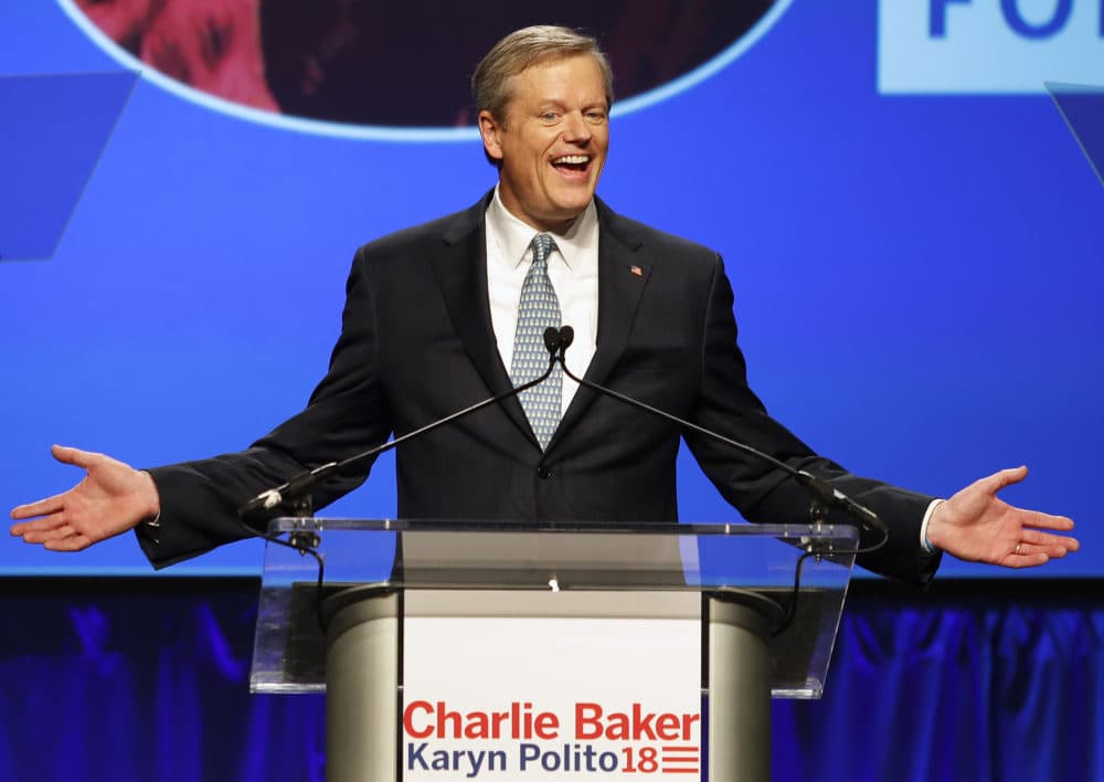 Republican Gov. Charlie Baker acknowledges applause from supporters during an election night rally Tuesday in Boston. (Winslow Townson/AP)