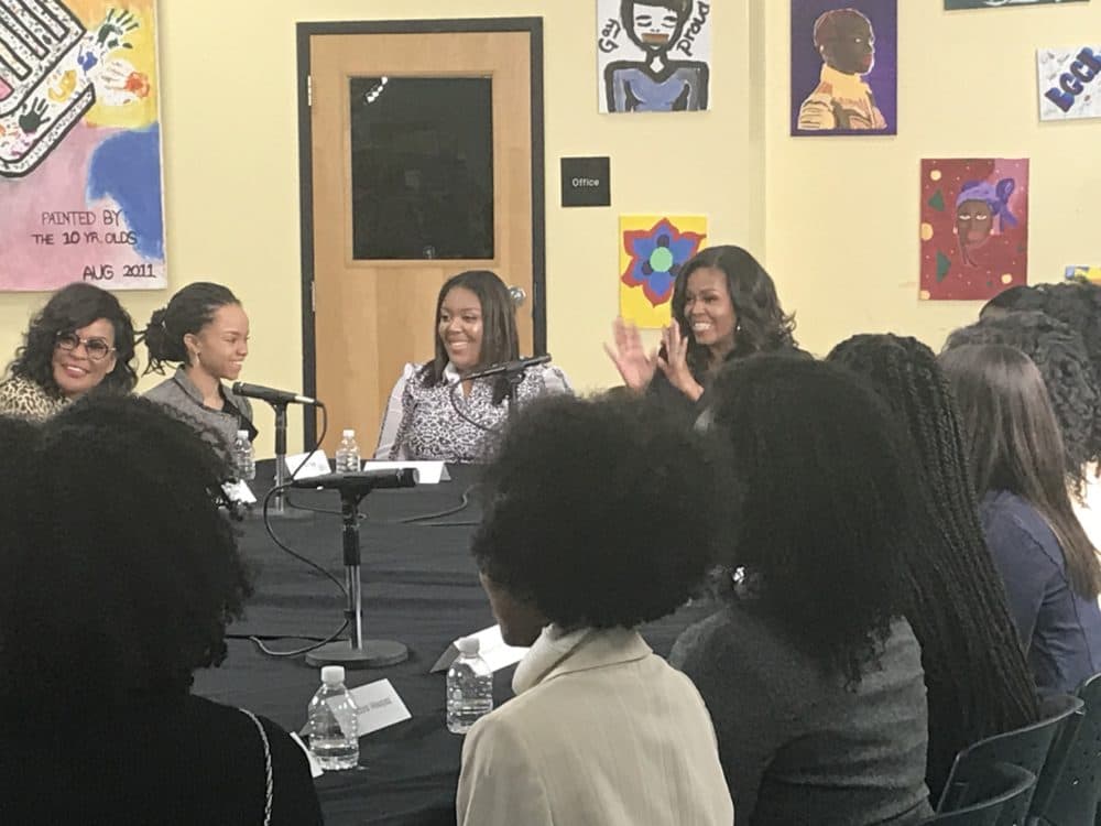 Former First Lady Michelle Obama speaks to a group of young women at the Boys & Girls Club in Dorchester on Nov. 24, 2018. (Quincy Walters/WBUR)