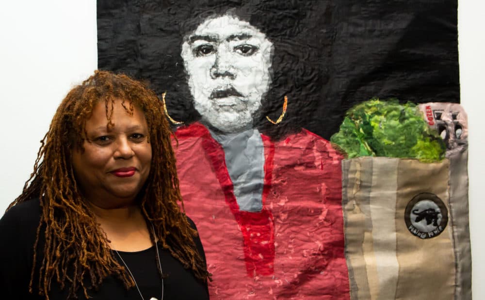 L’Merchie Frazier with her mixed-media quilt which depicts Black Panther Party activist Ericka Huckins (Courtesy Melissa Blackall and Cooper Gallery of African and African American Art)