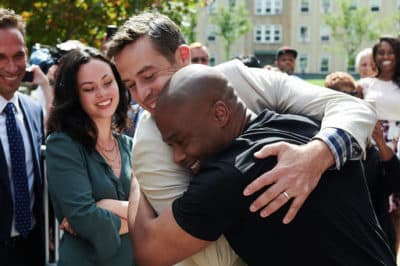 Max Adler greets Valentino Dixon as he walks out of the courtroom a free man. (Jonathan Mehring/Courtesy Golf Digest)