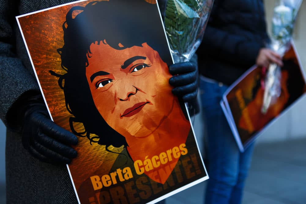 Demonstrators hold a portrait of human rights and land rights defender Berta Cáceres, of Honduras, at a vigil in Washington, D.C. on April 5, 2016. (Keith Lane/Oxfam America)