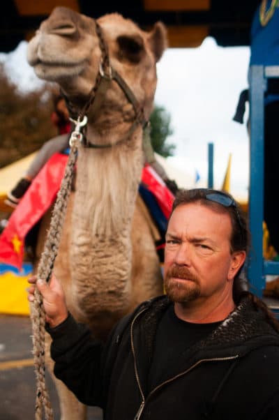Tim Commerford with one of his camels at the Big E in October. (Ben James/NEPR)