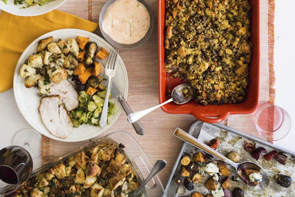 This October 2017 photo provided by Katie Workman shows food on the table at her apartment in New York. When you are making a big Thanksgiving dinner getting as much done ahead of time - and enlisting as much help from family and friends as possible  makes these epic meals much more enjoyable. (Sarah Crowder/Katie Workman via AP)
