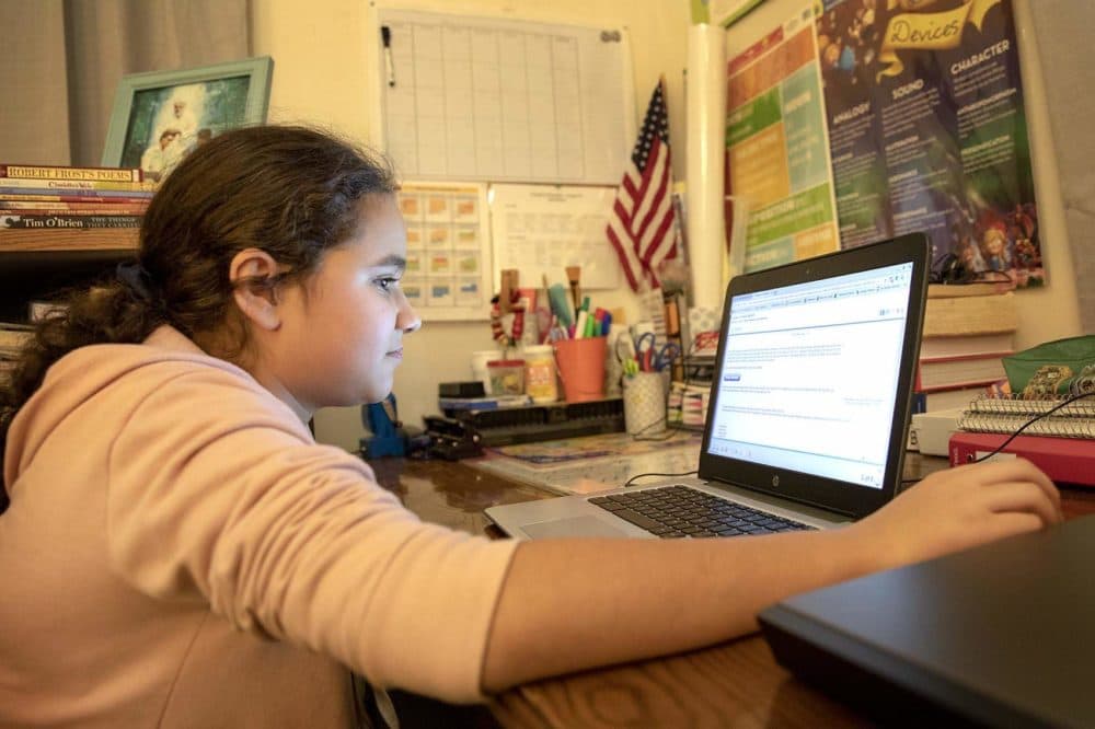 Eve, 13, studies on her computer. (Robin Lubbock/WBUR)