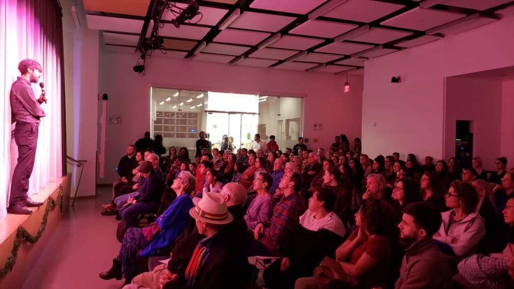 Vahdat Yeganeh, artistic director of Boston Experimental Theatre, addressing the audience at last Friday's performance. (Courtesy Marion Davis)