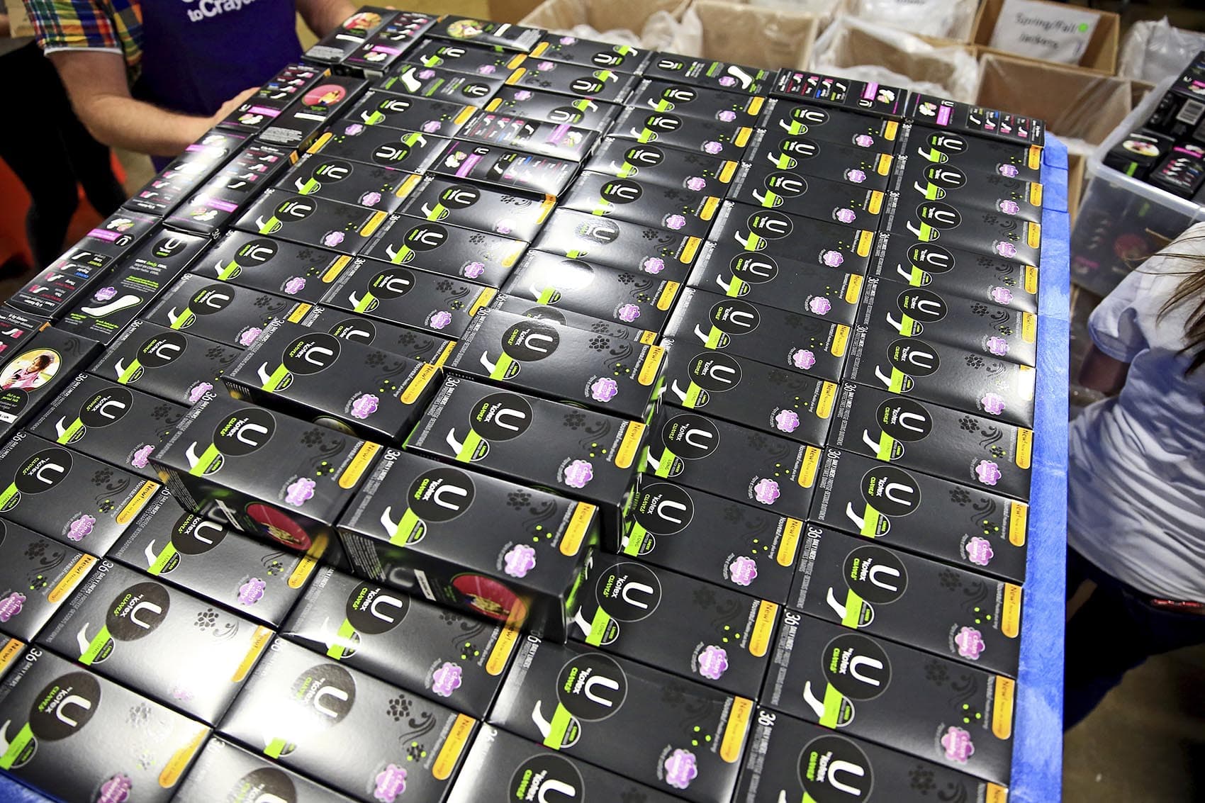 Volunteers from Walgreens sort U by Kotex period products on May 31, 2018 in Chicago. (Andrew Weber/AP Images for U by Kotex and Walgreens)