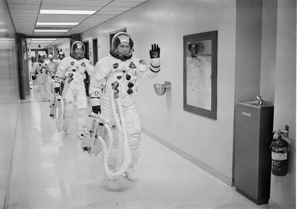 Commander Frank Borman leads the way for fellow astronauts Jim Lovell and Bill Anders as they leave the suit-up room for the launch pad. (Courtesy WGBH/NASA)