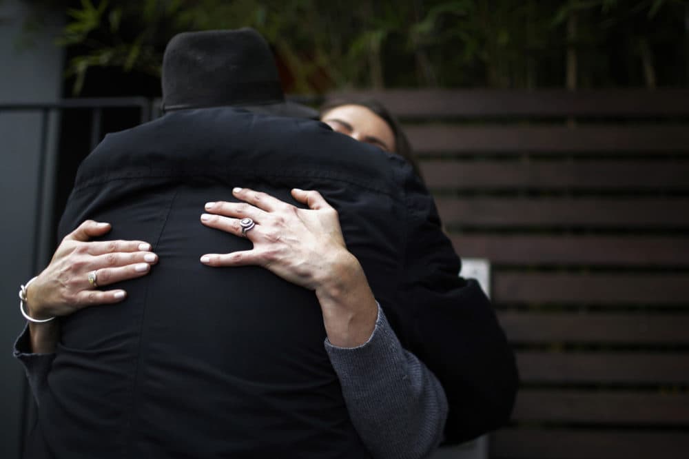 Peter Peacock, foreground, and Gypsy Diamond, 36, hug each other before parting ways after their second meeting, in Melbourne, Australia, Thursday, May 17, 2018. Peacock, who donated sperm anonymously around 1980, was recently contacted by Diamond, his biological daughter, after a new law in Australia retroactively removed the anonymity granted to sperm donors decades ago. (Wong Maye-E/AP)