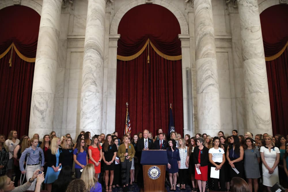 In this Tuesday, July 24, 2018 file photo, Sen. Jerry Moran, R-Kansas, center left, and Sen. Richard Blumenthal, D-Conn., attend a news conference with dozens of women and girls who were sexually abused by Larry Nassar, a former doctor for Michigan State University athletics and USA Gymnastics on Capitol Hill in Washington. Nassar is on his way to prison for the rest of his life, but the scandal is far from over at the university as victims, lawmakers and a judge demand to know why he wasn't stopped years ago. (Jacquelyn Martin/AP)