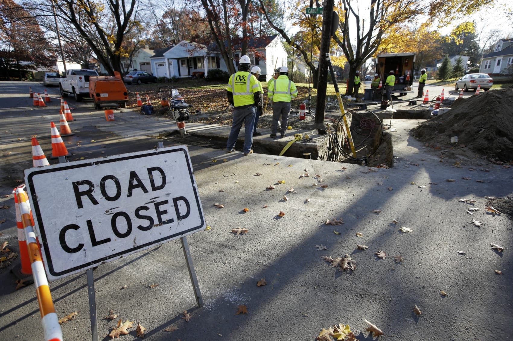 On Nov. 8, natural gas contract workers repair underground gas lines in Lawrence. (Steven Senne/AP)
