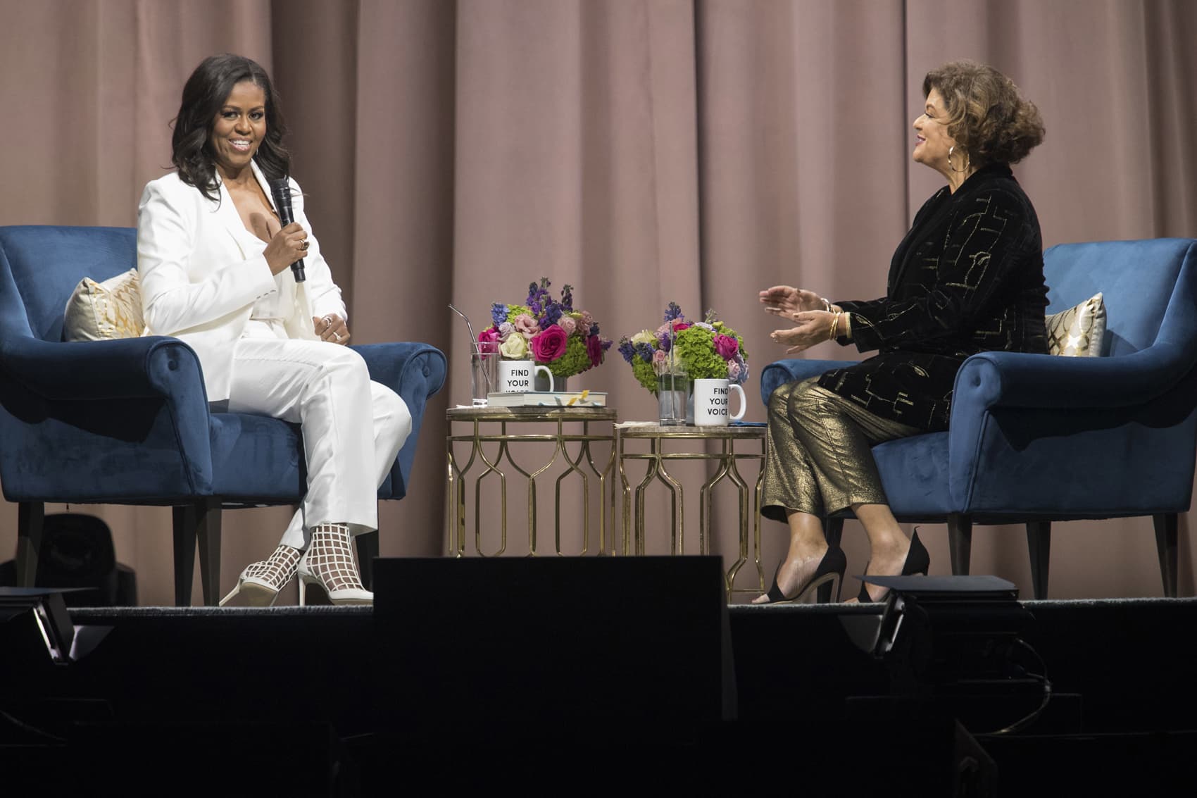 Former first lady Michelle Obama, left, is interviewed by Elizabeth Alexander during the "Becoming: An Intimate Conversation with Michelle Obama" at Barclays Center in Saturday, Dec. 1, 2018, in New York. (Mary Altaffer/AP)