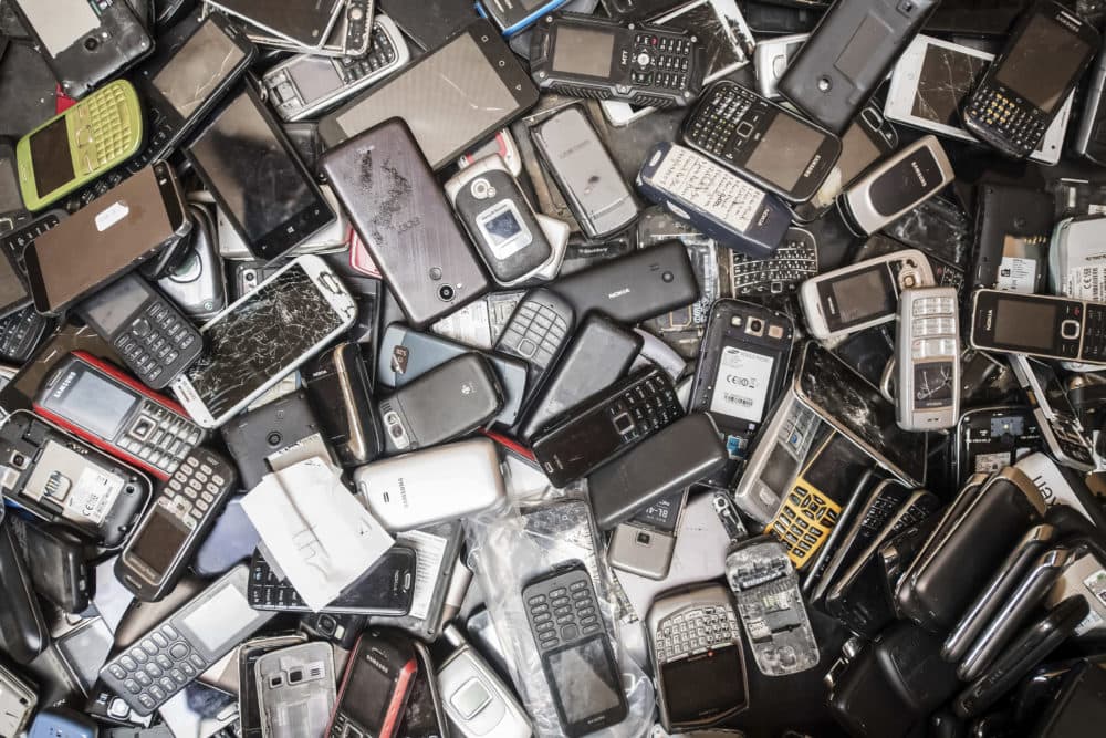 In this photo taken on July 13, 2018, old mobile phones fill a bin at the Out Of Use company warehouse in Beringen, Belgium. European Union nations are expected to produce more than 12 million tons of electronic waste per year by 2020. (Geert Vanden Wijngaert/AP)