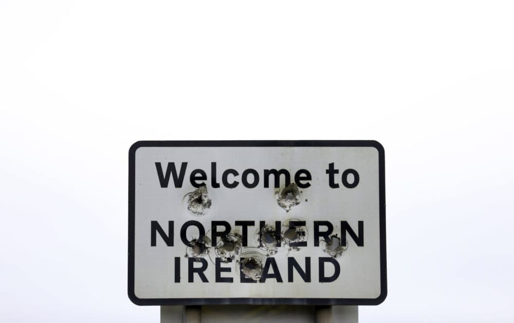 Bullet holes are seen in a sign welcoming people to Northern Ireland on the border between Northern Ireland and the Republic of Ireland, near the town of Derrylin, Northern Ireland, Wednesday, Dec. 12, 2018. (Peter Morrison/AP)
