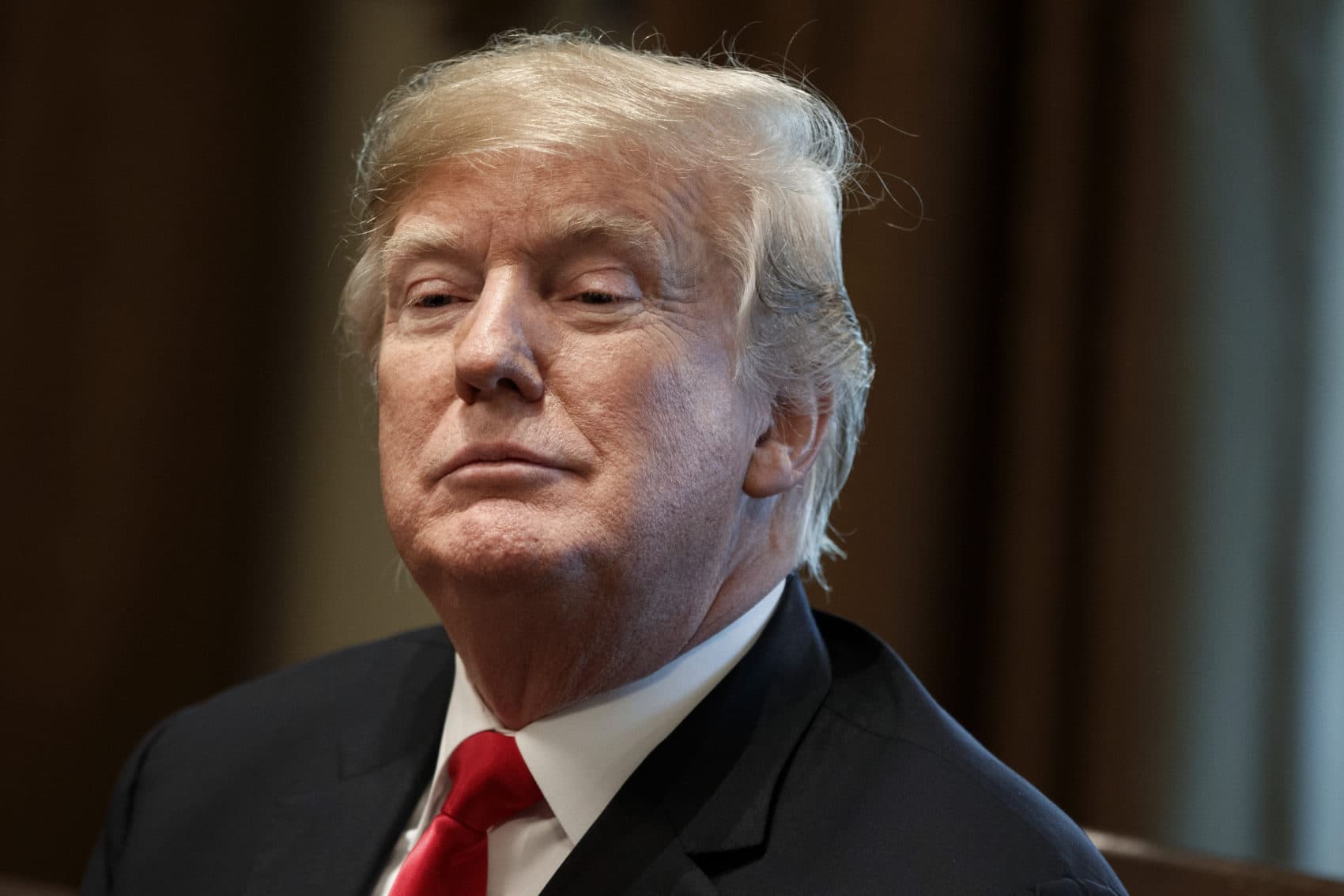 In this Dec. 13, 2018, file photo, President Donald Trump listens during a meeting in the Cabinet Room of the White House in Washington. (Evan Vucci/AP)