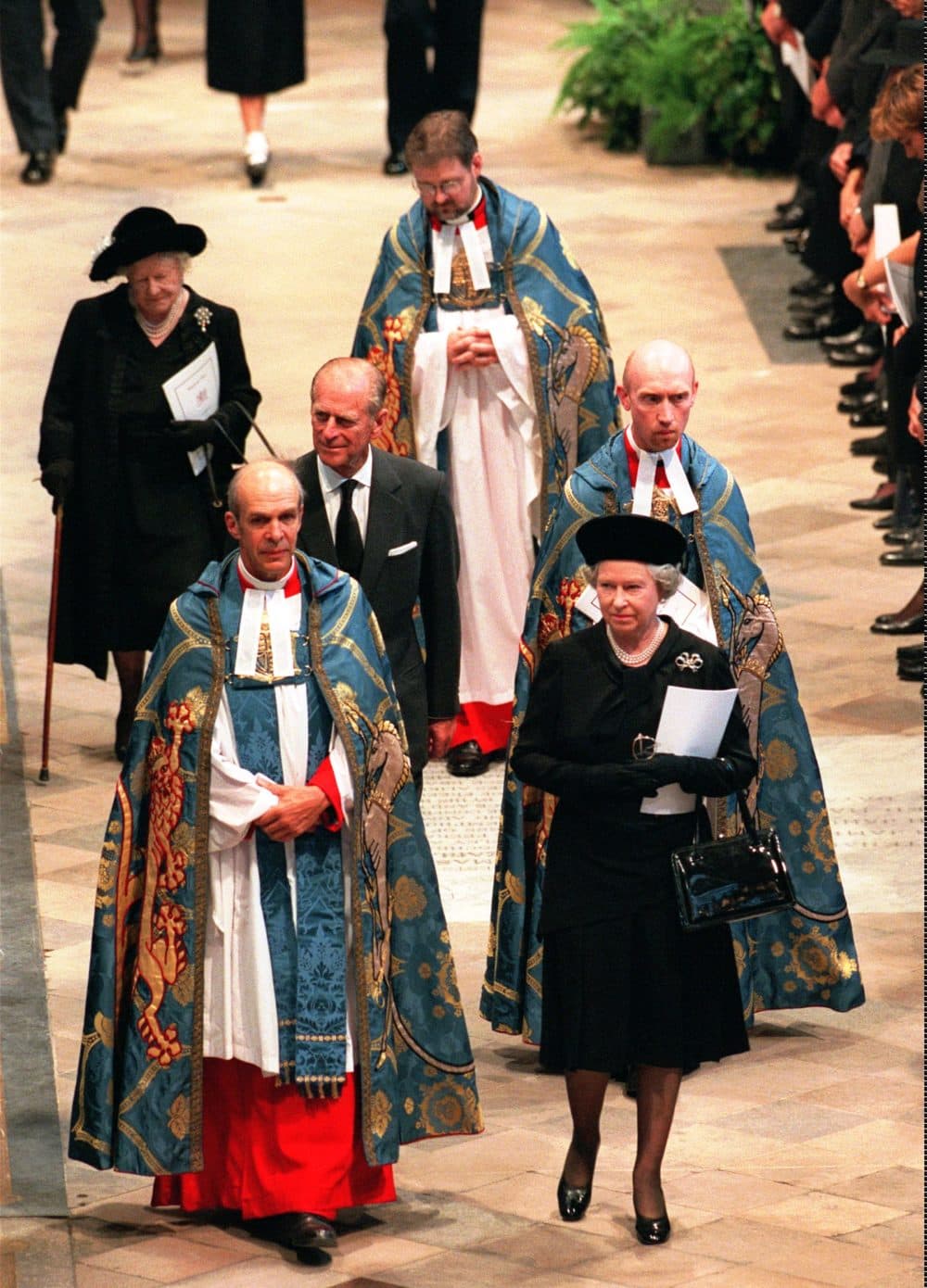 Britain's Queen Elizabeth II, her husband Prince Philip, and Queen Elizabeth, the Queen Mother, are escorted into London's Westminster Abbey, Saturday Sept. 6, 1997, for the funeral of Diana, Princess of Wales.(Peter Dejong/AP)