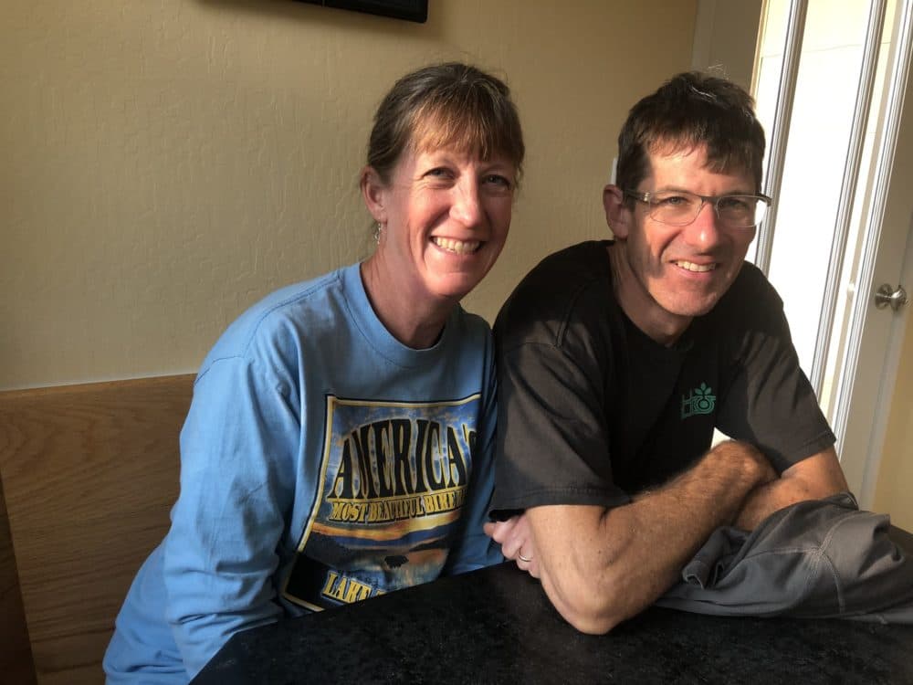 Ann and Kent Moriarty sit at their home in Pinole, California, on Nov. 18, 2018. "Dealing with immigration is confusing. We are not lawyers. Quite often we are in the position of not knowing what’s the next step to take," said Kent, about trying to support Veronica Aguilar and another Salvadoran family seeking asylum whom they are hosting. (Farida Jhabvala Romero/KQED)