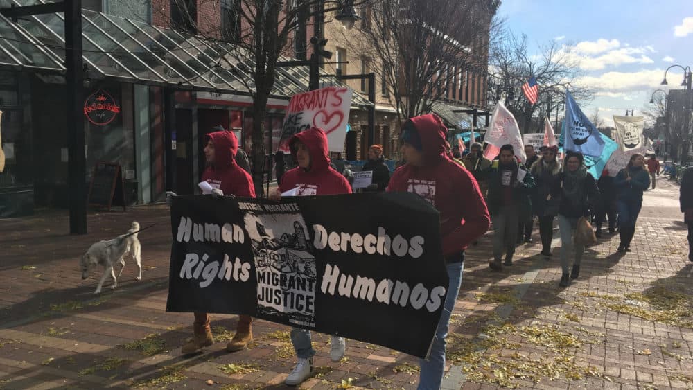 Farmworkers marched to the federal courthouse in November in Burlington, Vt. to file a lawsuit that alleges their leaders were targeted by ICE, with the help of the state DMV. (Liam Elder-Connors/VPR)