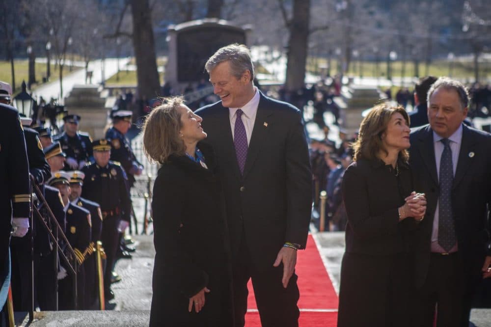Charlie Baker and his wife, Lauren, arrive at the Mass. State House. (Jesse Costa/WBUR)