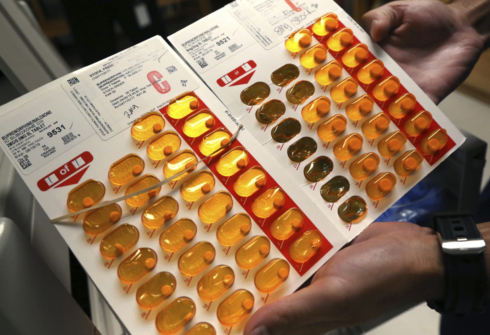 Nurse Brian Toia holds tabs of buprenorphine, also known by the brand name, Suboxone, in Greenfield, Mass. in July 2018, (Elise Amendola/AP)