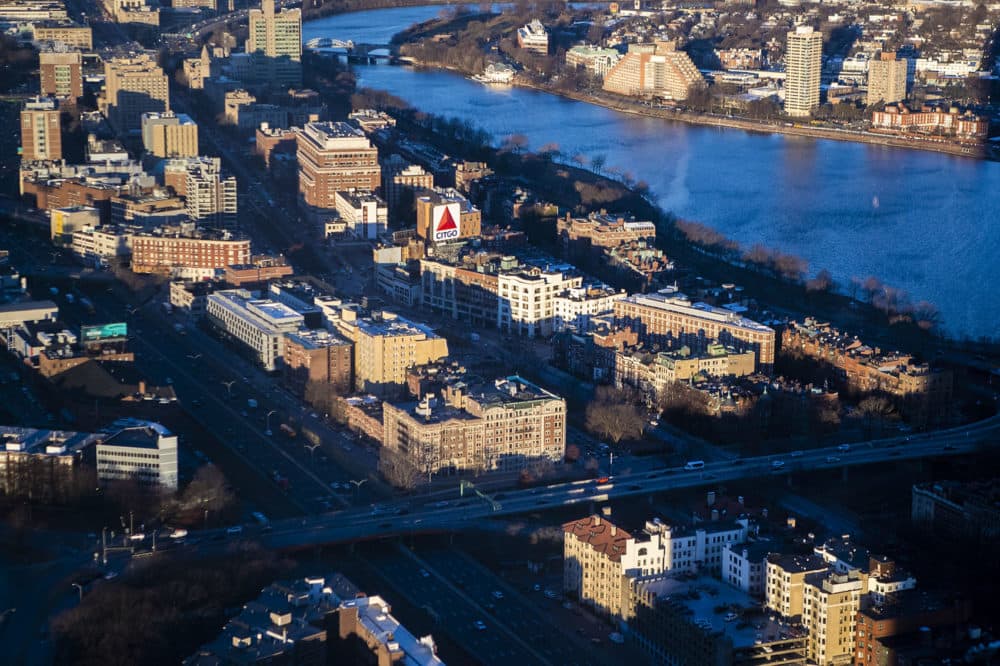 The early morning sun illuminates the Citgo Sign and the tops of other buildings around Kenmore Square. (Jesse Costa/WBUR)