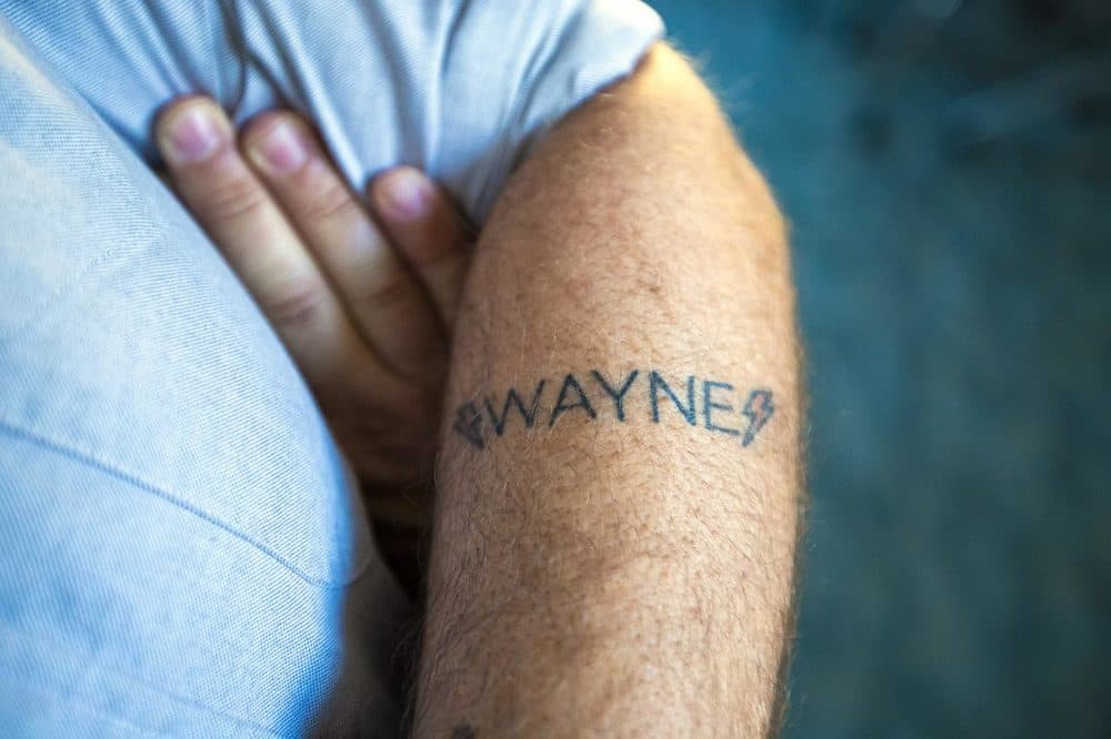 A Wayne tattoo on the forearm of the shows creator Shawn Simmons. (Jesse Costa/WBUR)