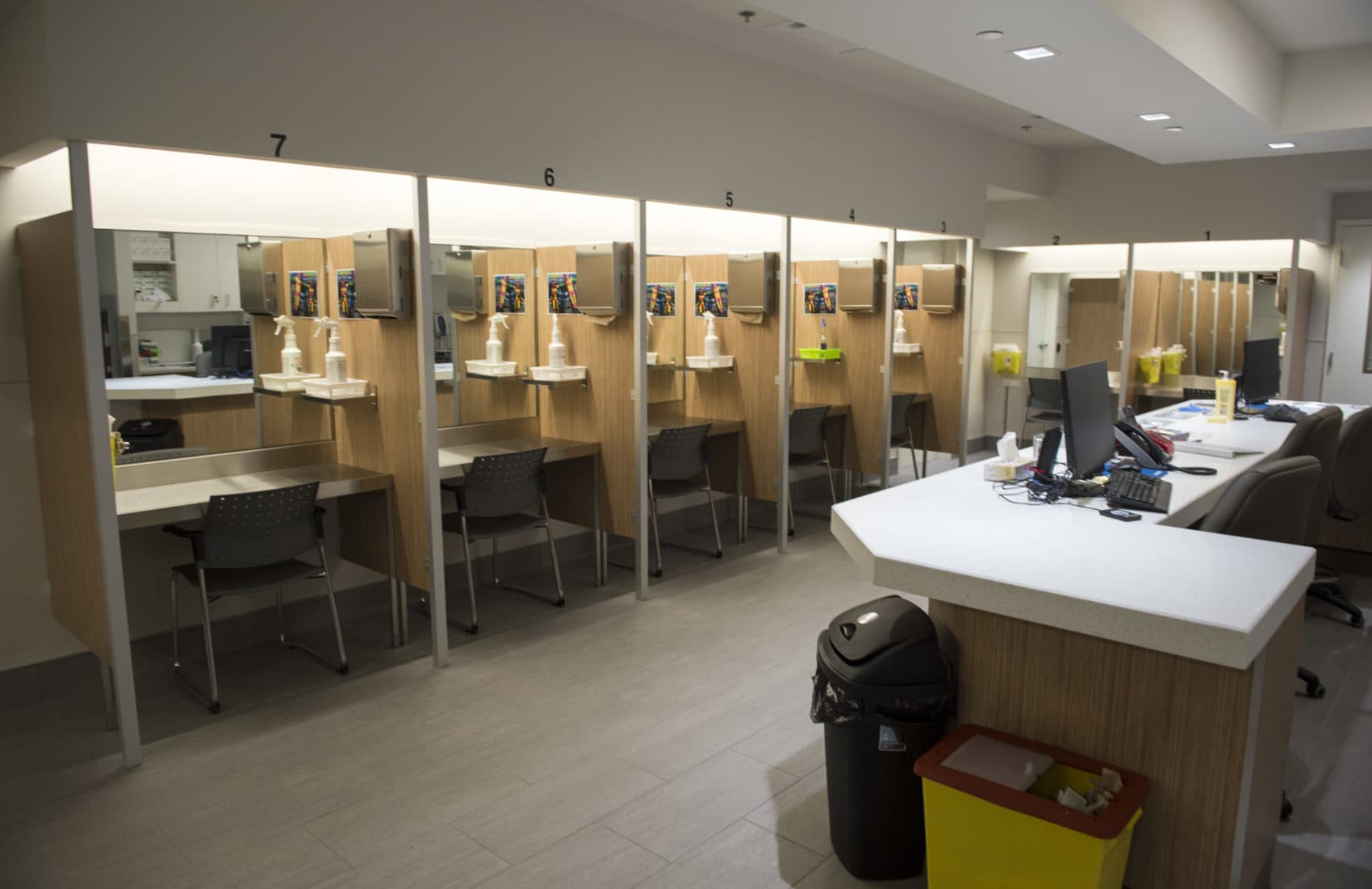 In this June 2017 photo, booths line the Cactus "safe injection site," where drug addicts can shoot up using clean needles, get medical supervision and freedom from arrest, in Montreal. (Paul Chiasson/The Canadian Press via AP)