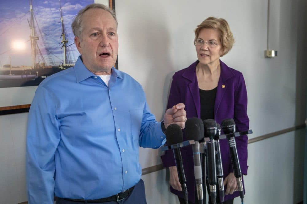 Steven Calder, an inspector for the Environmental Protection Agency, speaks alongside U.S. Sen. Elizabeth Warren after her visit in Boston with federal workers affected by the recent partial government shutdown. (Jesse Costa/WBUR)