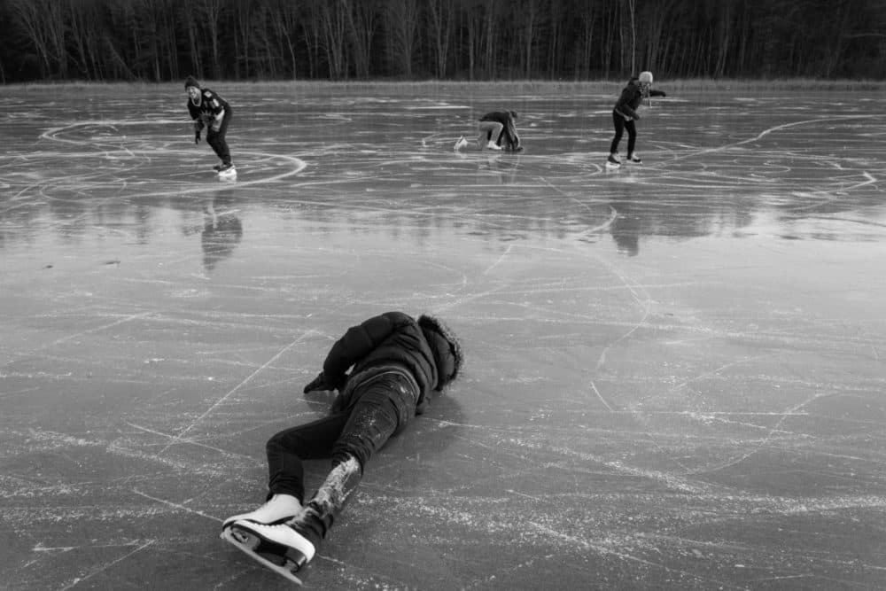 People skate and enjoy the smooth black ice. At rear, from left, on the ice: Dave Marks, Kate Popetz and Anna Morningstar. At foreground: Rachael Tani. (Ellery Berenger/NEPR)