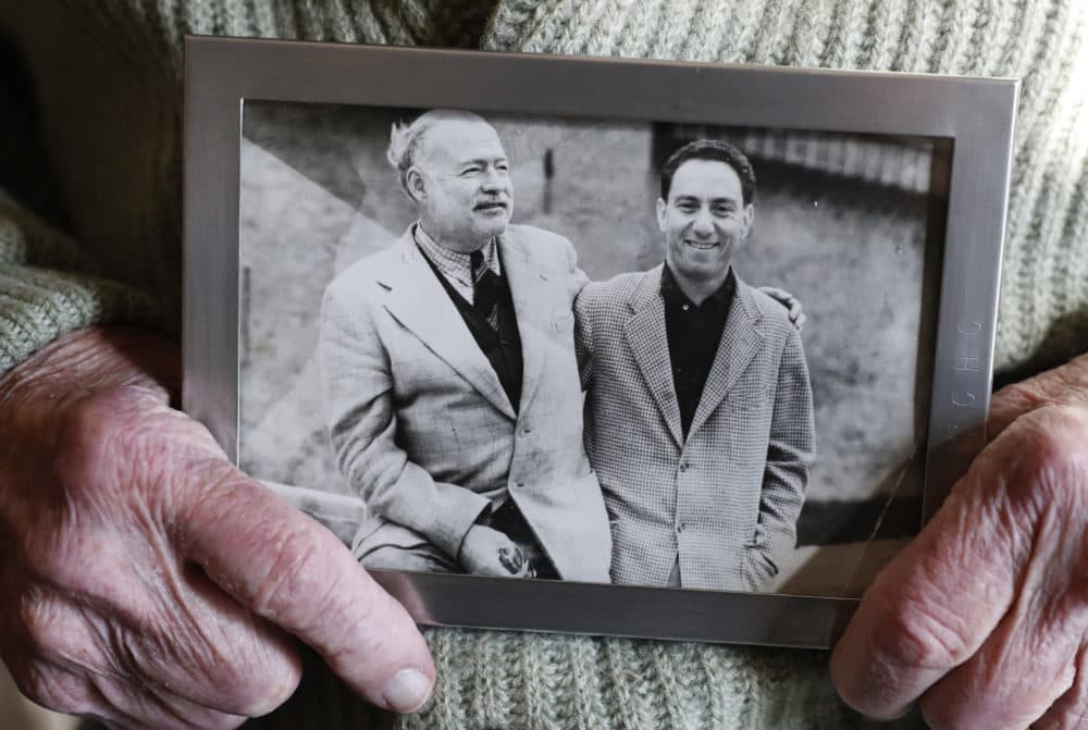 Ernest Hemingway's close friend and biographer A.E. Hotchner holds a photograph of the pair together, Tuesday, Jan. 22, 2019, at the Hotchner family home in Westport, Conn. (Kathy Willens/AP)