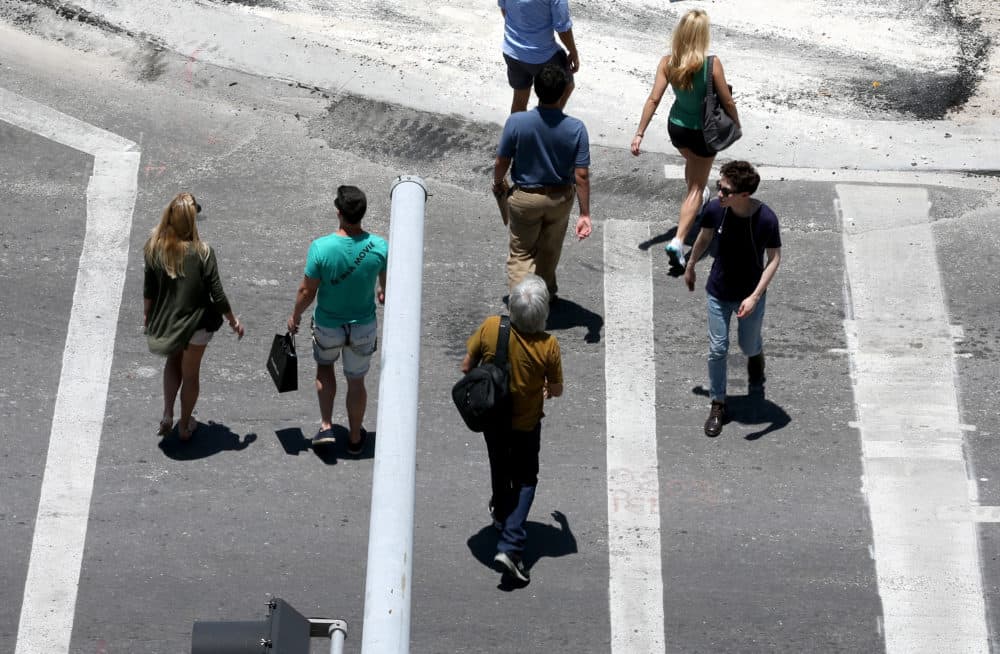 Florida is the most dangerous state in the country for pedestrians, according to a new report. Pictured: Pedestrians are cross the road in Miami in 2014. (Joe Raedle/Getty Images)