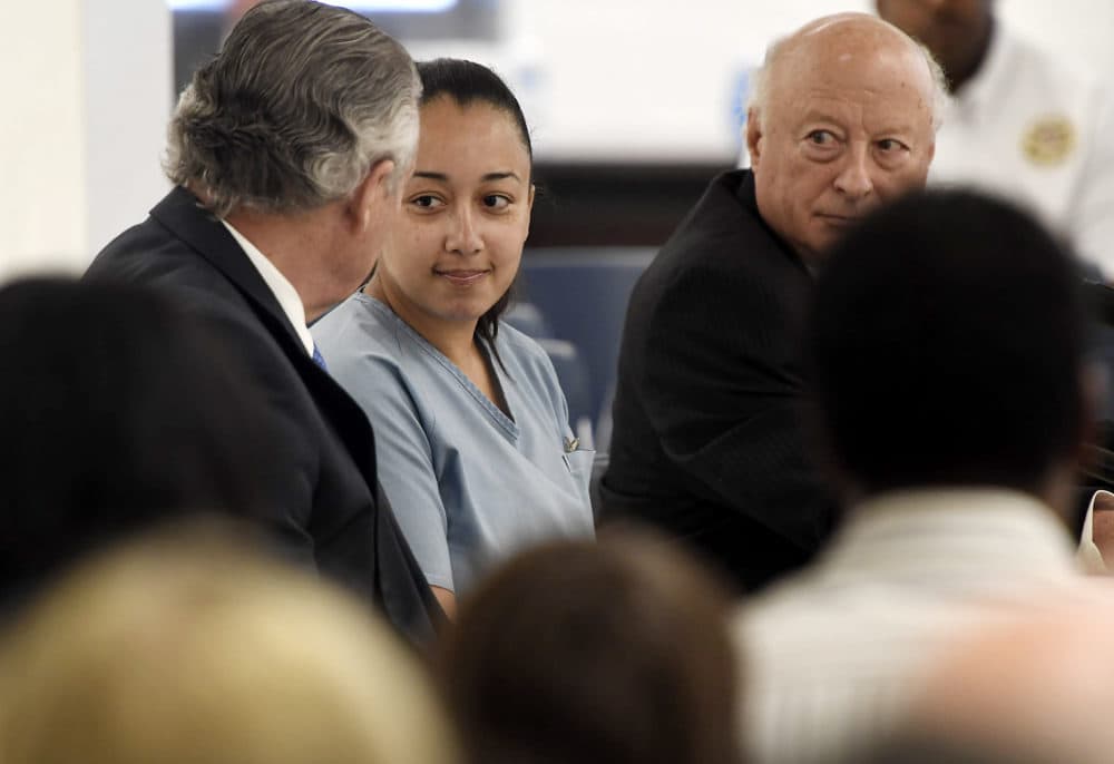 Cyntoia Brown, a woman serving a life sentence for killing a man when she was a 16-year-old prostitute, talks with her attorney, Charles Bone, during her clemency hearing Wednesday, May 23, 2018, at Tennessee Prison for Women in Nashville, Tenn. (Lacy Atkins /The Tennessean via AP, Pool)