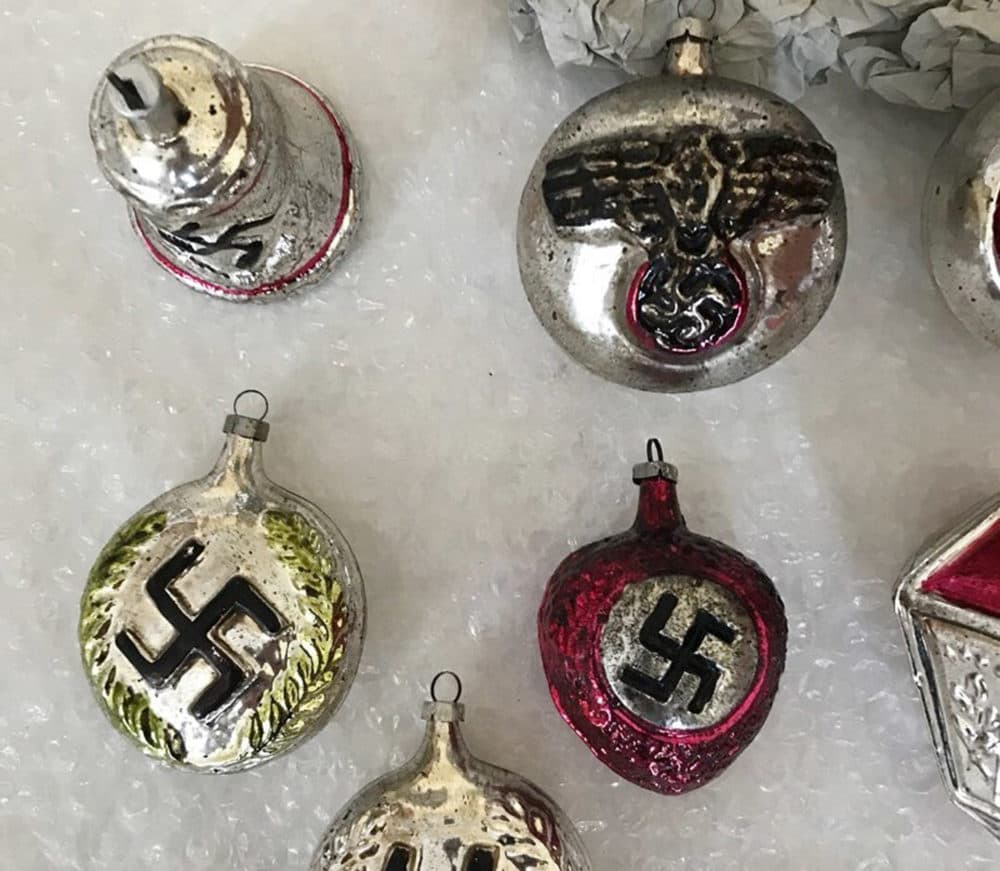 In this undated photo Christmas baubles bearing Nazi insignia are displayed. Denmark's largest online sale website DBA, has removed Nazi-themed items from its store, including 12 Christmas baubles, bought in Lithuania by Danish man Claus Dalsborg who wanted to sell them for 10,000 kroner (U.S. $1,520). (Claus Dalsborg/AP)