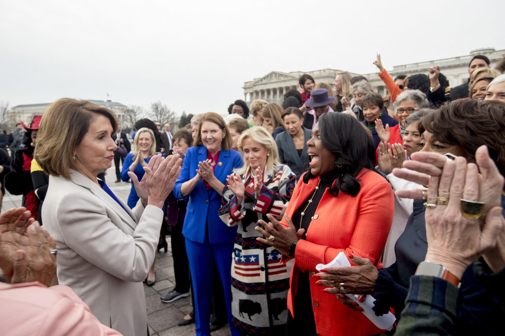 House Speaker Nancy Pelosi of Calif., left, applauds after a group portrait of the House Democratic women members of the 116th Congress on the East Front Capitol Plaza Capitol Hill in Washington, Friday, Jan. 4, 2019, as the 116th Congress begins. (Andrew Harnik/AP)