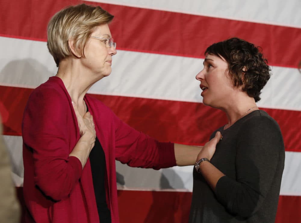 Sen. Elizabeth Warren, D-Mass., left, talks with Christa Lautner, right, of Urbandale about student loans and predatory lending after an organizing event at Curate event space in Des Moines, Iowa, on Saturday, Jan. 5, 2019. (Matthew Putney/AP)
