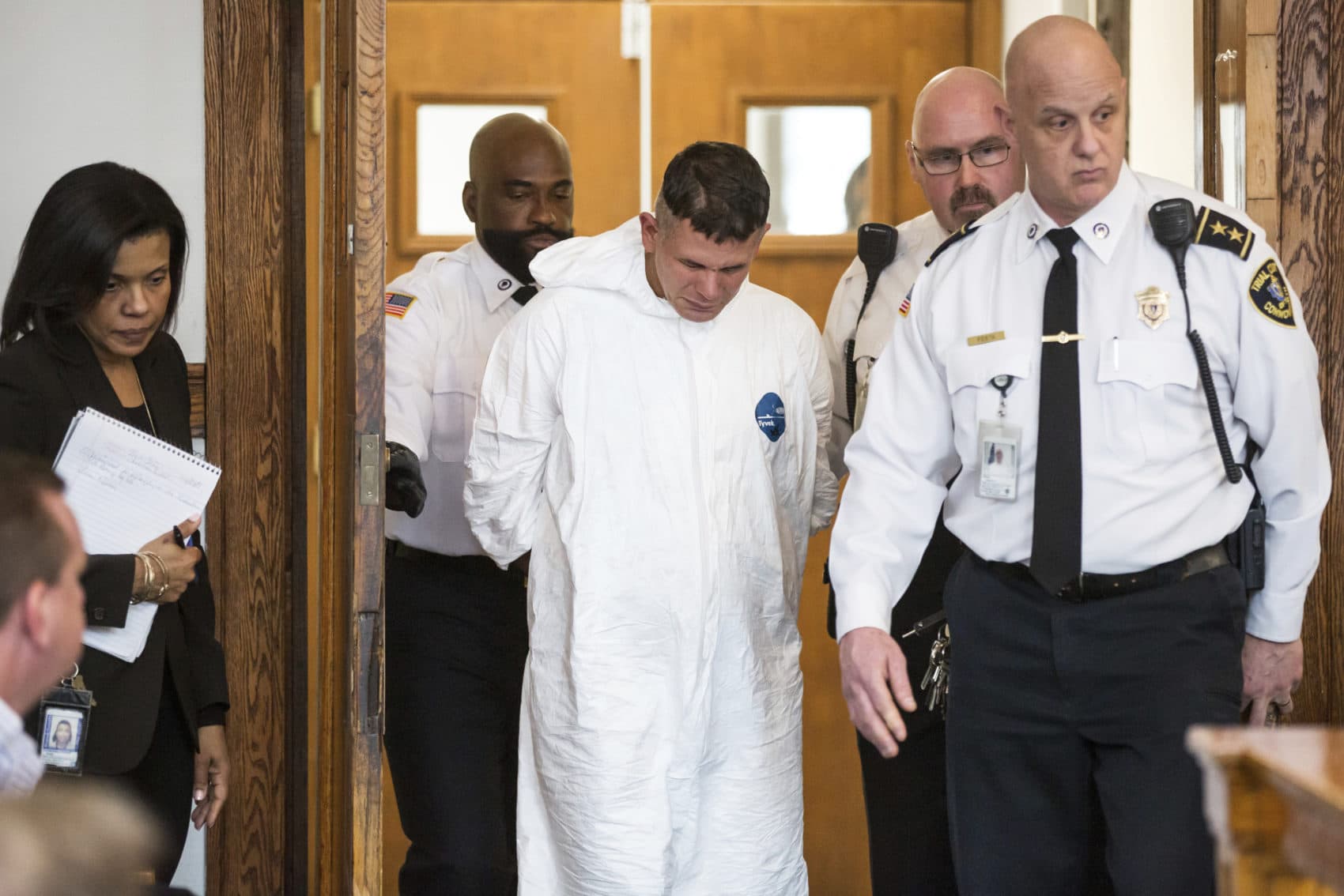 Victor Pena, center, appears at the Charlestown Division of the Boston Municipal Court Wednesday. Pena, who has been charged with kidnapping a 23-year-old woman, was ordered to undergo a mental health evaluation and will be held without bail. (Aram Boghosian/The Boston Globe via AP Pool)