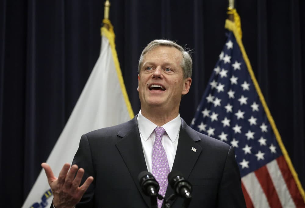 Massachusetts Gov. Charlie Baker faces reporters as he unveils his state budget proposal on Jan. 23, 2019. (Steven Senne/AP)