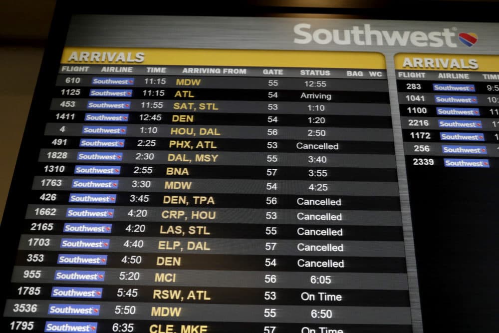 Cancelled flights are seen on an arrivals board at the Southwest Airlines ticketing area at LaGuardia Airport, Friday, Jan. 25, 2019, in New York. The Federal Aviation Administration reported delays in air travel Friday because of a "slight increase in sick leave" at two East Coast air traffic control facilities. (Julio Cortez/AP)