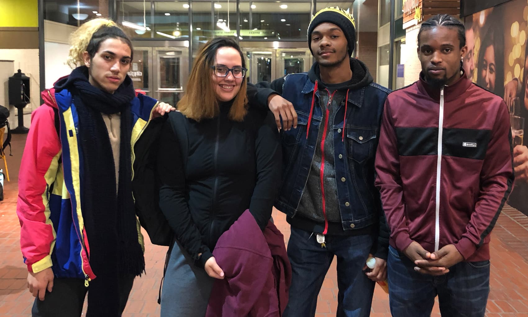 From left to right: Boston Adult Technical Academy students Luis Pacheco, Amanda Vega and Javon Barbour, alongside Nilton Brandom, who graduated last spring (Max Larkin/WBUR)