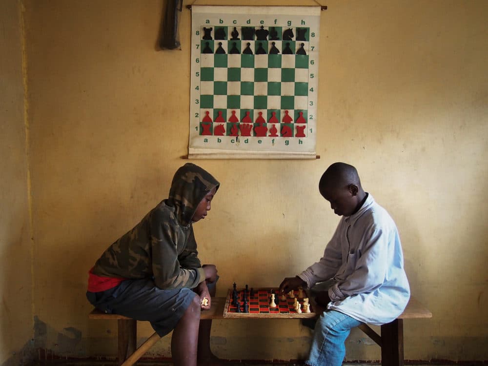 Children play at the Kampala chess club where Phiona Mutesi first learned the game. (Michele Siblioni/AFP/Getty Images)
