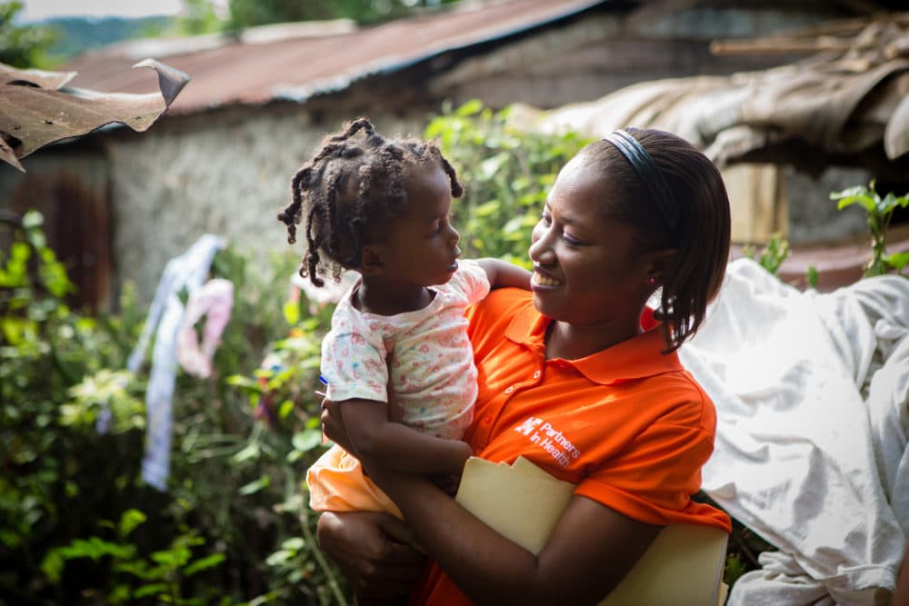 BOUCAN CARRE, HAITI - . 
Nurse Asmine Pierre holds Maylove Louis, 14 months, during a home visit in Boucan Carré, Haiti. Louis is four months into the malnutrition program.
(Courtesy Partners In Health)