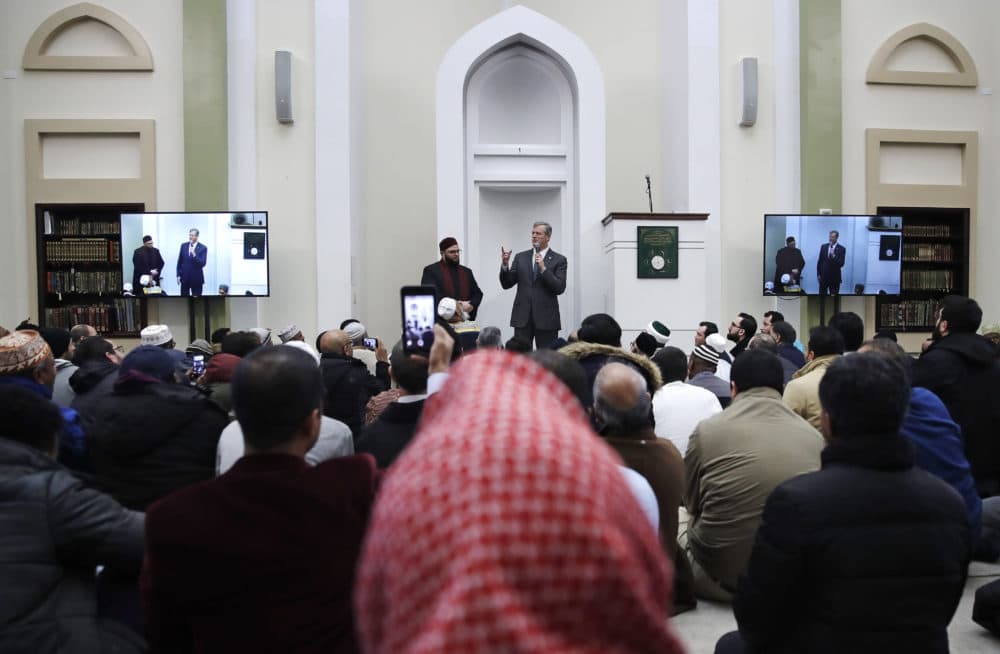 Massachusetts Gov. Charlie Baker, center, addresses a prayer service at the Islamic Society of Boston Cultural Center's mosque in Boston on Friday. (Charles Krupa/AP)