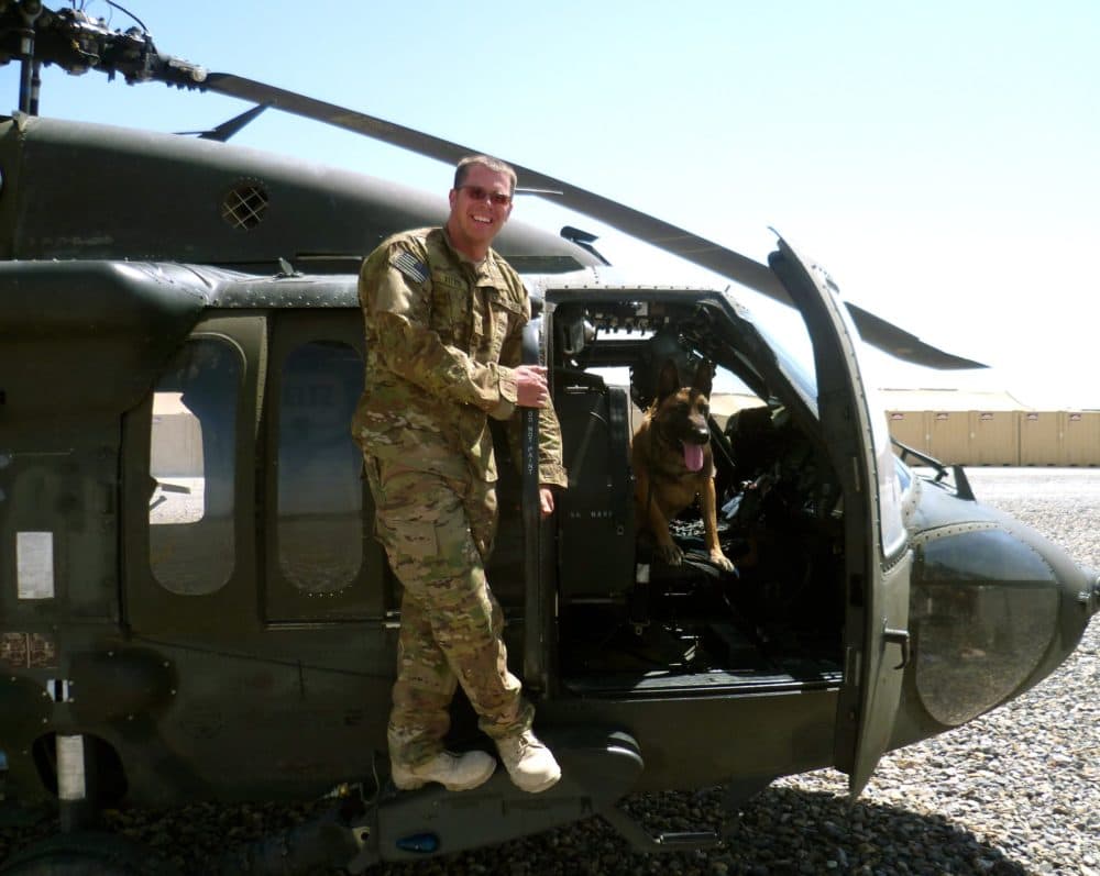 Dyngo with his former handler, Staff Sgt. Justin Kitts, while on deployment in Afghanistan in 2011. (Courtesy of Justin Kitts)